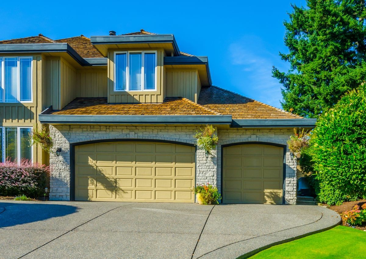 Garage, garage doors with long driveway.