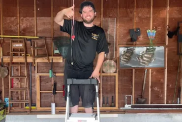 Garage door technician after completing garage door opener installation