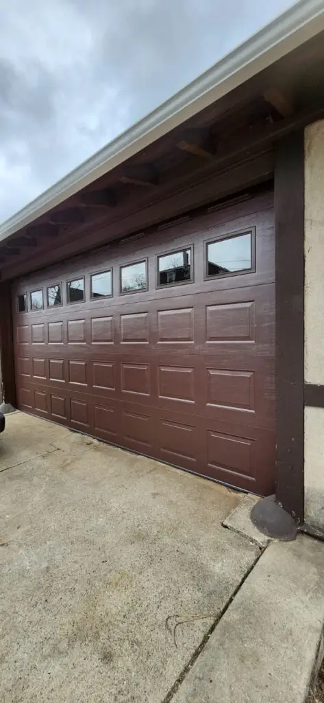 Carriage-Style Residential Garage Door With Decorative Hardware
