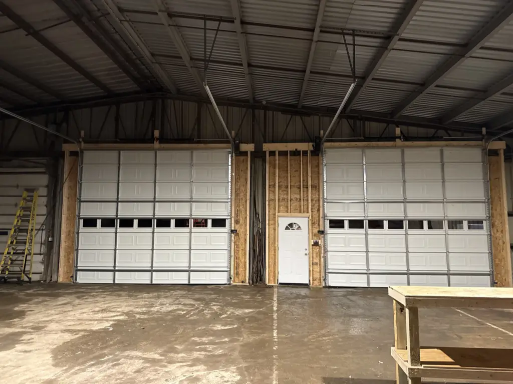 Interior view of a new commercial garage door installation by Triple A Garage Doors