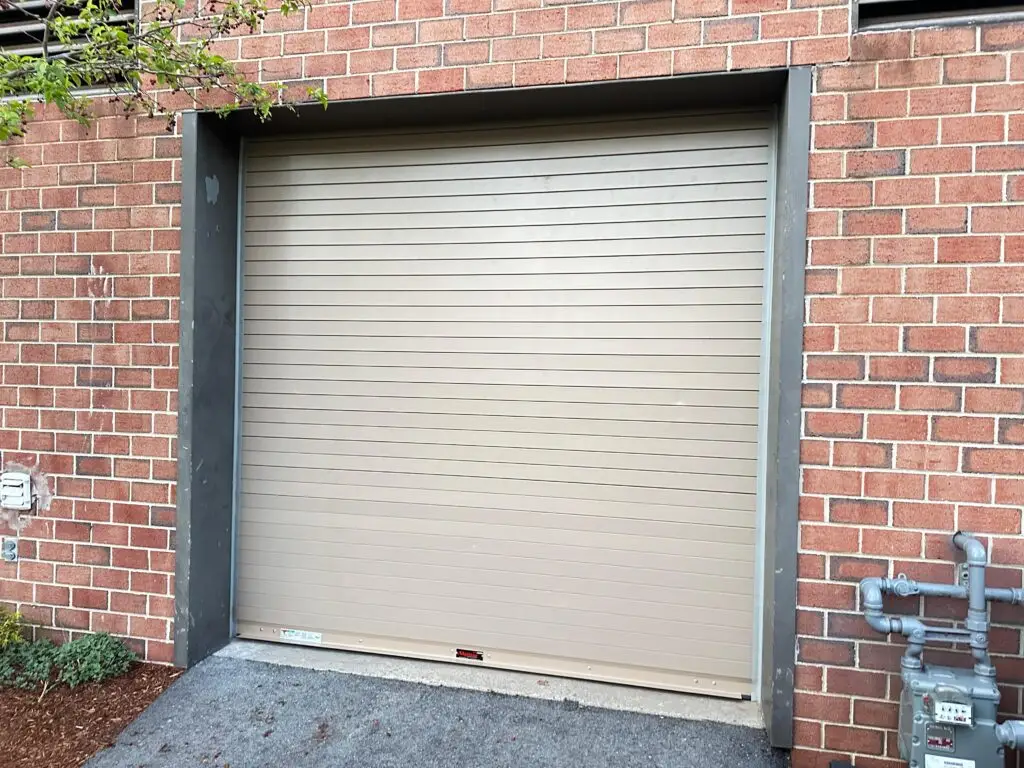Commercial Roll-Up Garage Door Installation On Brick Building In Massachusetts