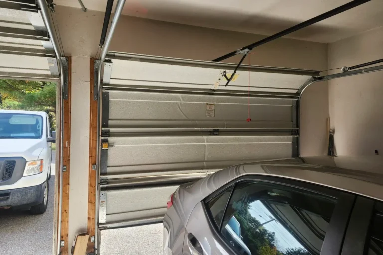 Blog 9 Garage Door Stuck Halfway Open Due To An Off-Track Problem During A Repair Service In Waltham, Ma.