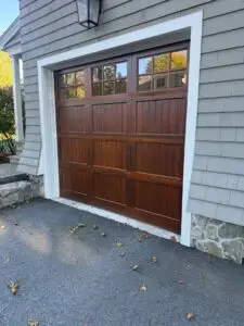 Brown Wood Garage Door With Upper Windows At A Lexington Massachusetts Home